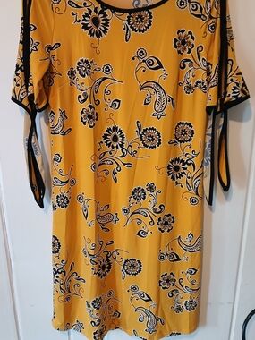 Tacera Yellow Dress with Black Floral Motif and Black Trim Tie Ups On Sleeves.